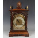 A late 19th century brass mounted burr walnut cased mantel clock with eight day movement striking