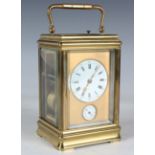 A mid to late 19th century lacquered brass grande sonnerie carriage alarm clock with eight day