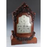 A Victorian mahogany bracket clock with eight day triple fusee movement chiming quarters on eight