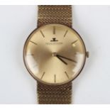 A Jaeger-LeCoultre 9ct gold gentleman's bracelet wristwatch, the signed brushed gilt dial with black