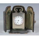 An Edwardian silver rectangular cased carriage timepiece, the circular enamel dial with Roman hour