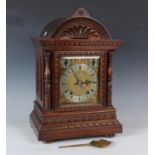 A late 19th century oak bracket clock with two train eight day movement striking quarters on two