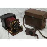 A brass mounted mahogany folding camera "The Sanderson Camera" in fibre case and leather carrying