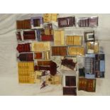 A box containing a selection of modern dolls house furniture,