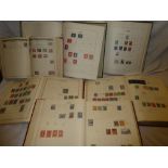 Six folder albums containing a selection of World stamps
