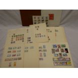 Various British Commonwealth stamps on album leaves including Gibraltar and Falkland Islands and