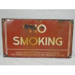 An enamelled rectangular sign "No Smoking - Issued by Request of the Interest of Public Welfare by