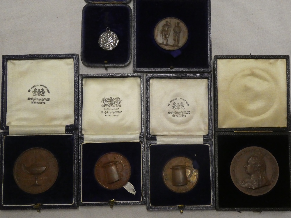 Six various cased medallions including bronze Astor County Shooting Cup medallions,