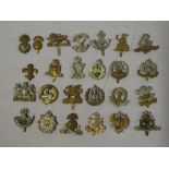 Twenty-five original Infantry cap badges including Manchester Regiment (two variations),