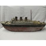 A 1920's/30's painted metal and wooden model liner,