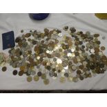A large selection of mixed GB and foreign coins including Victorian 1854 penny,