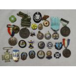 A selection of enamelled lapel badges and medallions including JW Engineer of Ramsbottom,