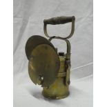 An old brass mounted acetylene miners lamp by the Premier Lamp Co.