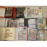 A large box containing seven albums of Commonwealth and World stamps together with folders of