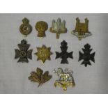 Ten original military cap badges including Loyal Suffolk Hussars, Buckinghamshire Battallion,