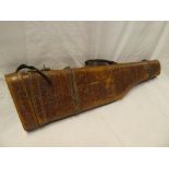 An old leather leg of mutton gun case with scaled decoration and hinged cover (to fit 27" barrels)