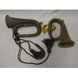An old brass mounted copper military bugle by J R Lafleur & Son London with cord tassles and one