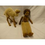 An old cloth covered doll by Nora Wellings and a plush covered camel figure (2)