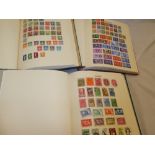 Three folder albums containing a selection of World stamps