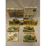 A selection of unmade boxed model kits including 3 Airfix Churchill tanks,