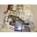 A box containing a large selection of GB stamps in packets, mint stamps PHQ cards,