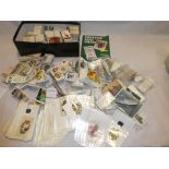 A large selection of sets and part sets of cigarette cards including BDV Silk Heraldic Series,