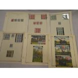 A collection of USA 1941 Defense' savings stamps with mint stamps in blocks,