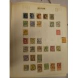 A folder album containing a collection of Belgium and Holland stamps