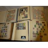 Six albums containing a selection of mixed World stamps