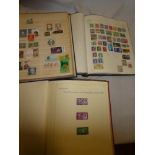 Three albums containing a selection of GB and World stamps,