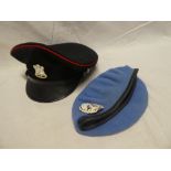 A Devon and Dorset Regiment peaked cap with anodised badge and a United Nations blue beret with