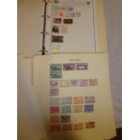 Two various folder albums containing a selection of World stamps