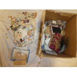 A box containing various World stamps on/off paper, stock cards of stamps,
