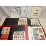 A collection of USA stamps in five folder albums,