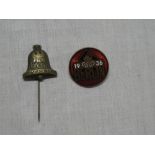 A German 1936 Olympic stick pin and similar enamelled badge