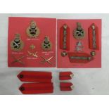 A display of British General Officer's insignia including Field Marshall's cap badge,