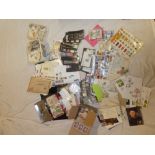 A box containing a large selection of various GB and World stamps in packets, on/off paper,