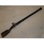 An unusual 19th Century Middle Eastern flintlock blunderbuss with 29" heavy steel flared barrel,