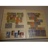 A stockbook of GB stamps KGV - QE11 including early mint commemoratives etc