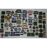 A collection of RAF and RAF Regiment badges including pilots wings, Warrant Officers cap badges,