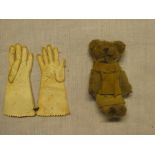 An old miniature teddy bear 2 1/2" long and a pair of miniature kid leather gloves