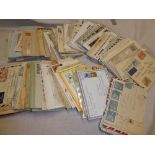 A box containing a selection of World postal history including covers and cards