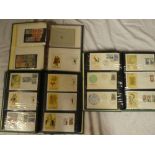 Three albums containing a collection of over 230 Spanish first day covers 1967-1973 and a small