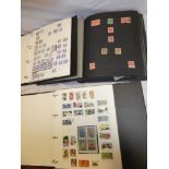 Three folder albums containing a collection of USA and Canada stamps