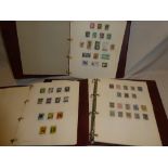 Three folder albums containing a collection of New Zealand stamps 1855-1988