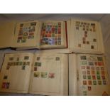 Five folder albums containing mixed World stamps