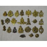 Various original military cap badges including Royal Canadian Army Medical Corps, Military Police,