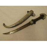 An Eastern dagger with curved single edged blade with silvered and polished wood hilt in silvered