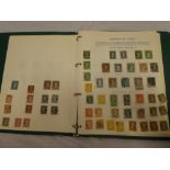 A folder album containing a collection of Canada stamps including Newfoundland, early Queens,