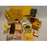 A Kodak Duoflex boxed camera and flash gun together with vintage accessories including photographic